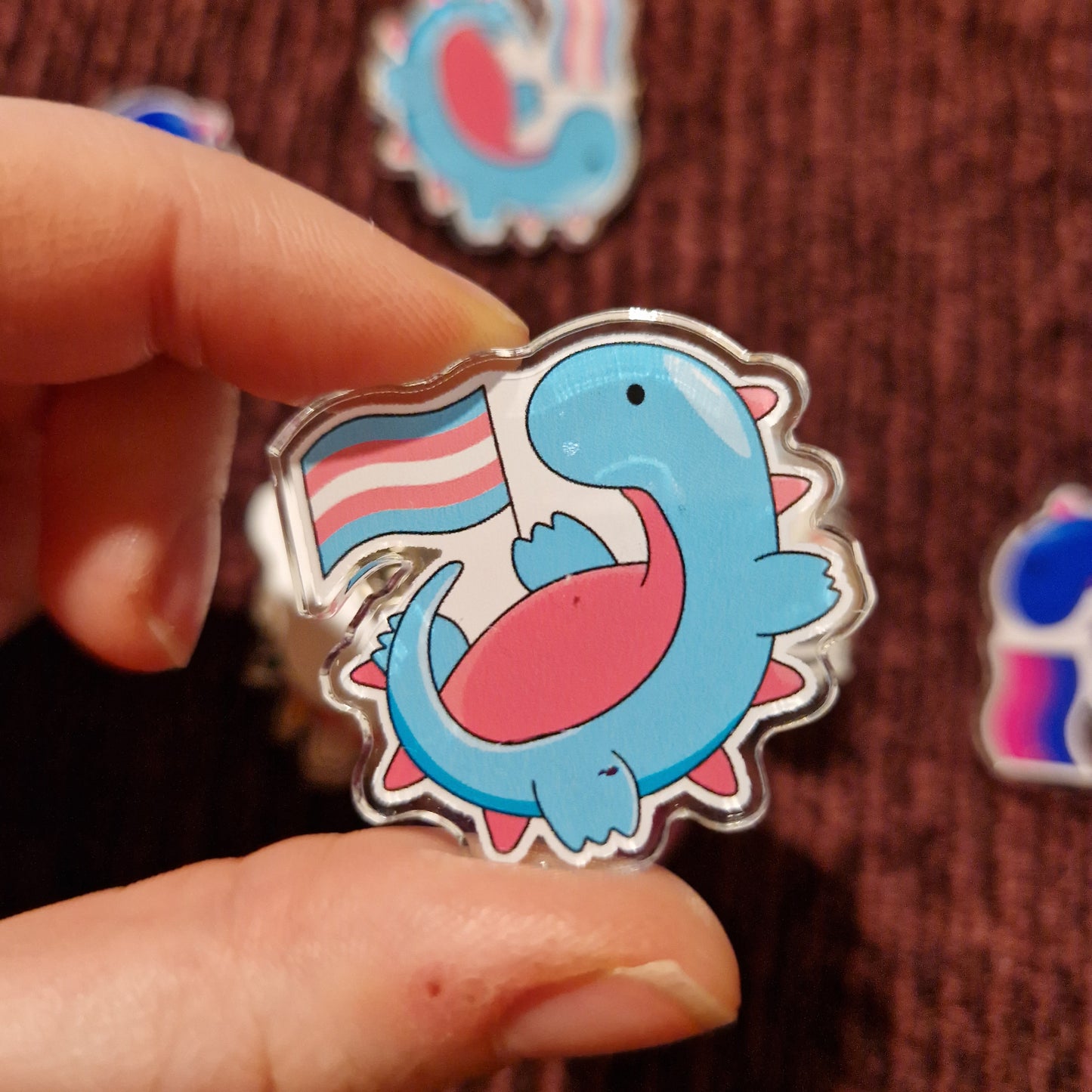 Damaged LGBTQ+ Dino Pins