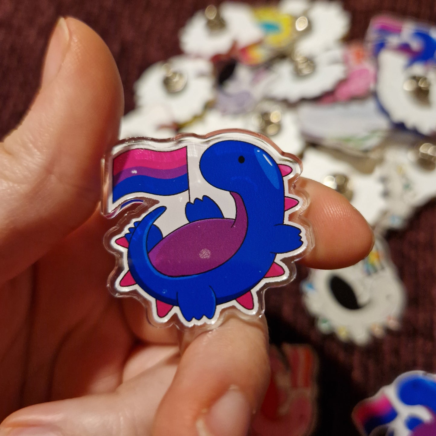 Damaged LGBTQ+ Dino Pins